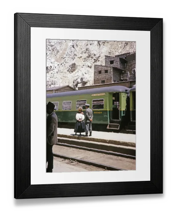 Framed Print : Indigenous woman and railway official standing on the platform at the train, La Oroya railway station, Peru, South America around 1962, South America