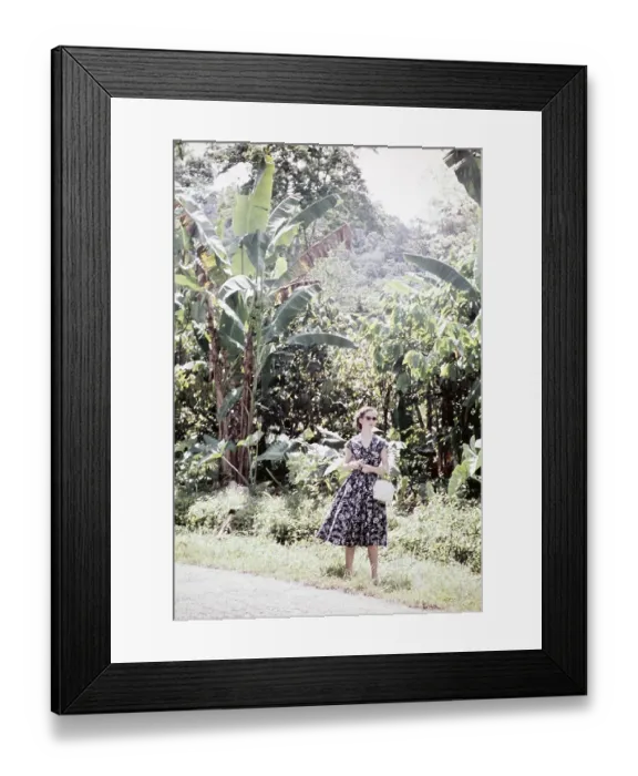 Framed Print : Woman on the roadside in a wooded area of Trinidad, around 1962 Framed Print : Woman on the roadside in a wooded area of Trinidad, around 1962