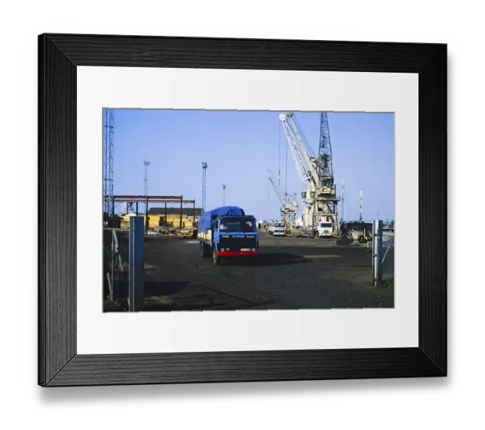 Framed Print : Harbour activity cranes and trucks, Kings Lynn, Norfolk, England, UK 1987 Framed Print : Harbour activity cranes and trucks, Kings Lynn, Norfolk, England, UK 1987