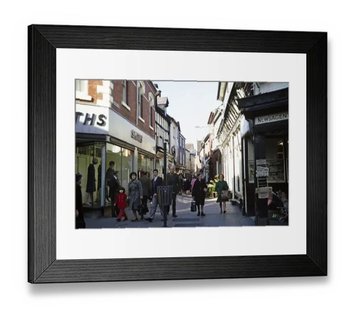 Framed Print : Strollers in the narrow medieval pedestrian street Drapers Lane in the city centre of York, Yorkshire, England, UK 1975 Framed Print : Strollers in the narrow medieval pedestrian street Drapers Lane in the city centre of York, Yorkshire, England, UK 1975
