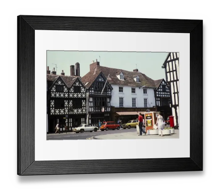 Framed Print : Historic buildings Tudor facades, High Street, Stratford on Avon, Warwickshire, England, UK 1982 including Freeman Hardy Willis shop