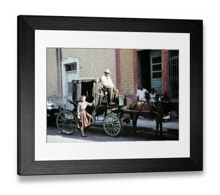 Framed Print : Female tourist in front of the Surrey horse-drawn carriage, Mexico, around 1961, Central America