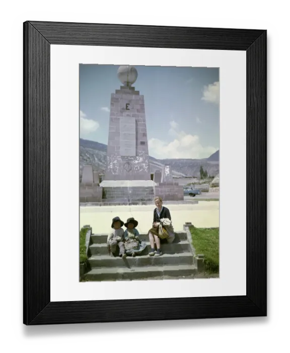 Framed Print : Tourist with local children at the equator monument from 1936, Ciudad Mitad del Mundo, Pichincha, Ecuador, South America 1962, South America