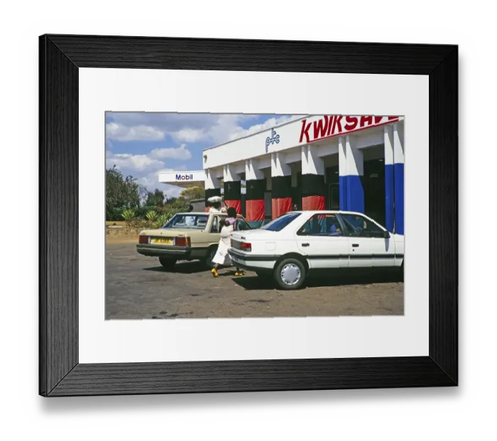 Framed Print : Exterior view of a Mobil petrol station and a Kwiksave PTC shop, Malawi, southern Africa, 1989, Africa
