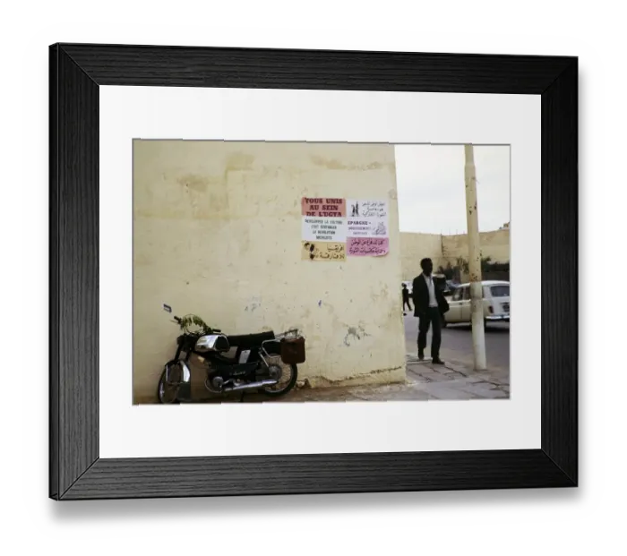 Framed Print : Political and commercial UGTA poster on a wall in the city of Ghardaia, Mʾzab Oasis, Tunisia, North Africa 1973, Africa