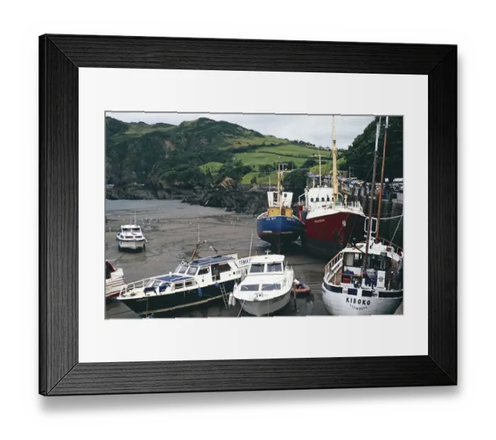 Framed Print : Boats in the harbour at low tide, Ilfracombe, North Devon, England, UK 1970s yacht Kiboko, registered in Yarmouth