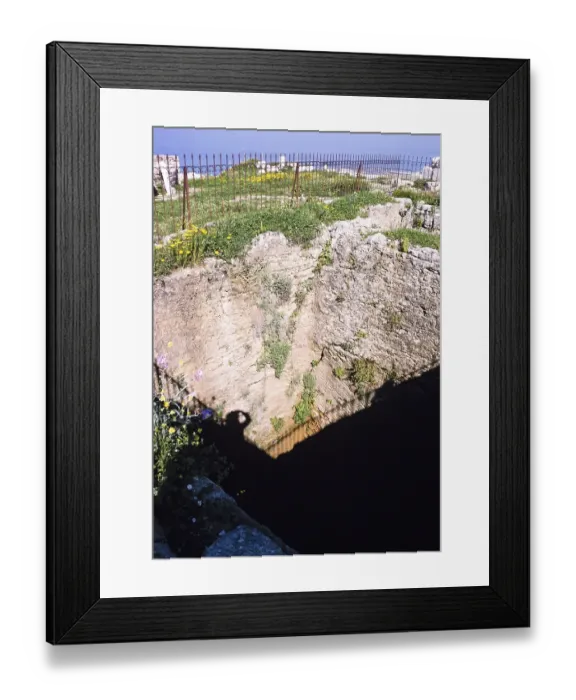 Framed Print : Deep wells for water supply in the ruins of the archaeological site of ancient Byblos, Lebanon 1998