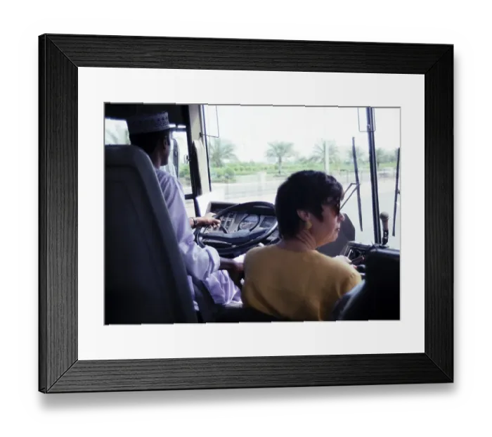 Framed Print : View through the windscreen of a coach with driver and tour guide, Muscat, Oman, Asia