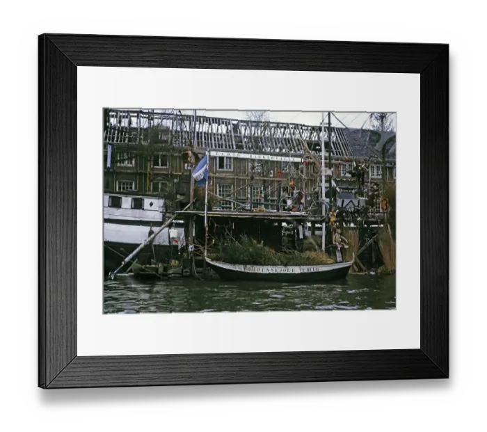Framed Print : Radio Baskerville sign on a canal boat next to a derelict building, Amsterdam 1973