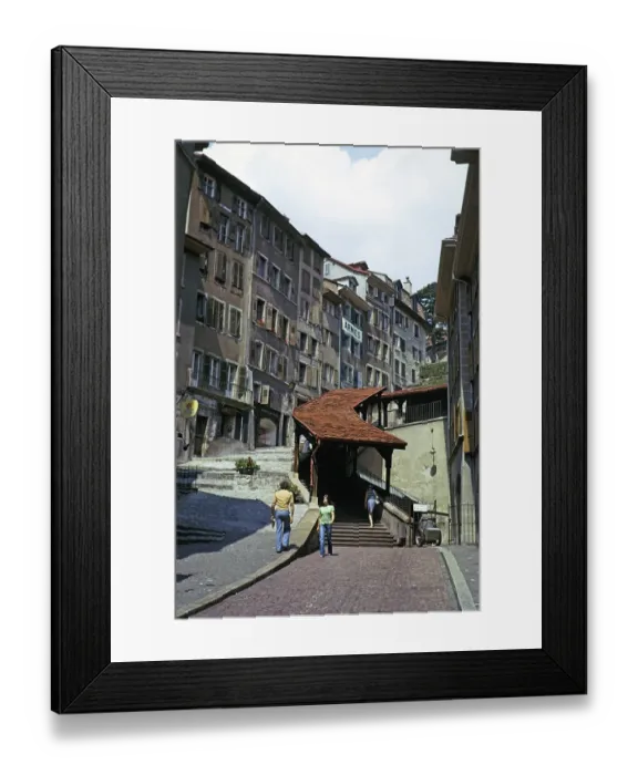 Framed Print : Historic buildings in the old town centre of Lausanne, Switzerland, 1974 covered staircase on the street, Europe