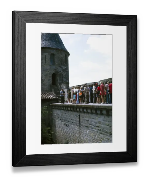 Framed Print : Walls, towers and ramparts UNESCO World Heritage Site, fortified town of Carcassonne, France 1973 Tourists on a guided tour Framed Print : Walls, towers and ramparts UNESCO World Heritage Site, fortified town of Carcassonne, France 1973 Tourists on a guided tour