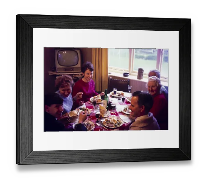 Framed Print : Traditional family Christmas meal all sitting around table eating and drinking, c 1960, England, UK