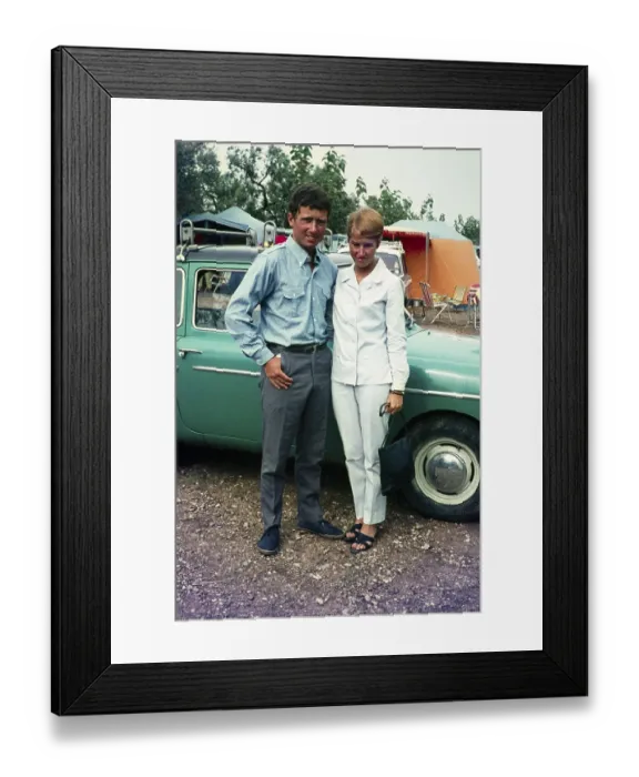 Framed Print : Stylish British couple standing next to their car at a campsite holiday in Spain, 1966 Framed Print : Stylish British couple standing next to their car at a campsite holiday in Spain, 1966