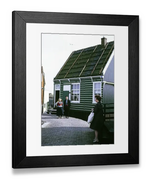 Framed Print : Man and woman in traditional dress standing in front of a village house, Mark, Netherlands, 1973