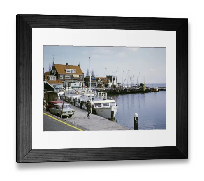 Framed Print : Volendam, Netherlands, 1973 Tourist boats on the quay, behind them fishing boats