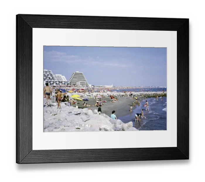 Framed Print : Crowded beach with modern pyramid-shaped hotels, La Grande Motte, Herault, France 1972