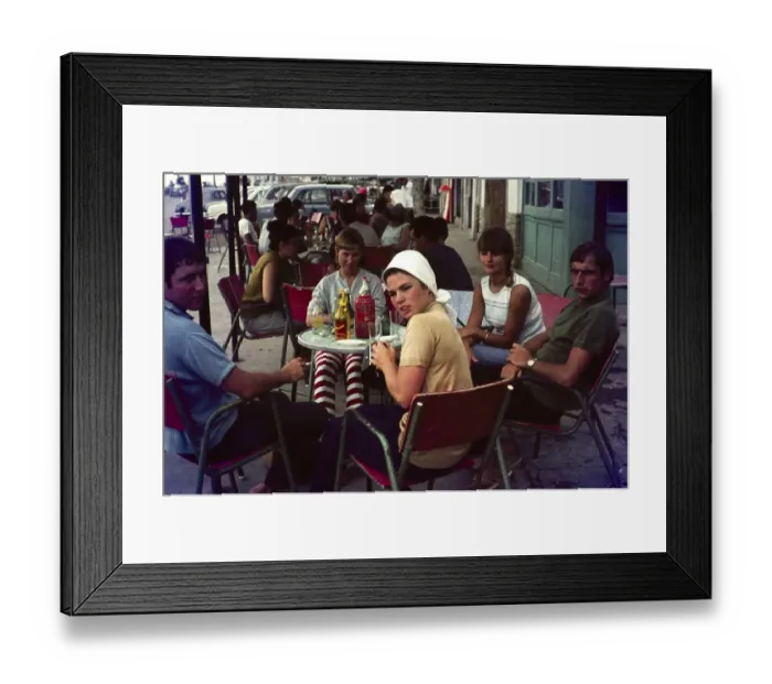 Framed Print : Group of young British people on holiday sitting around a cafe table, Spain, 1966, Europe
