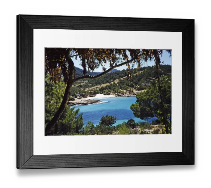 Framed Print : Coastal landscape view through trees of blue sea sandy beach, island of Ibiza, Balearic Islands, Spain, 1950s, Europe