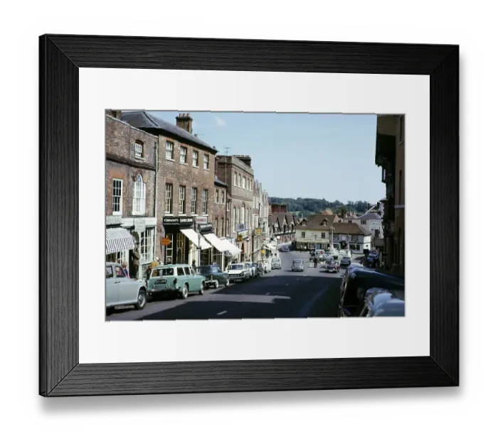 Framed Print : Cars and shops in Arundel town centre, West Sussex, England.1965 Framed Print : Cars and shops in Arundel town centre, West Sussex, England.1965