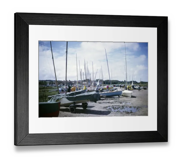 Framed Print : Boats on the beach and in the village of Brancaster, Norfolk, England 1966 Framed Print : Boats on the beach and in the village of Brancaster, Norfolk, England 1966