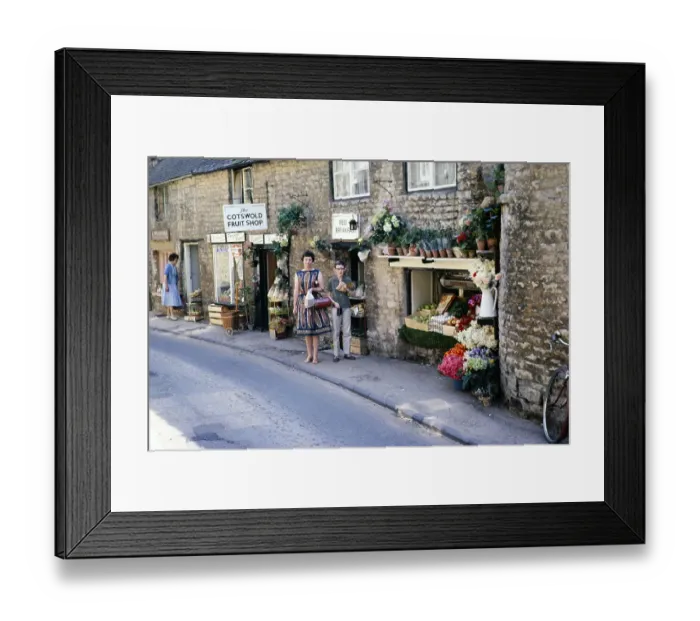 Framed Print : Stow on the Wold, Gloucestershire, England 1963 Woman and boy posing in front of a fruit shop in Cotswold