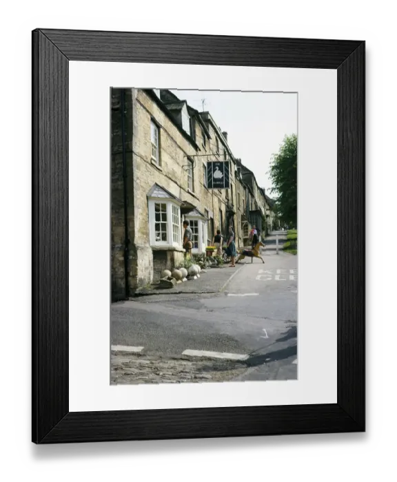 Framed Print : Flower shop with people outside on the High Street in the Cotswold town of Burford, Gloucestershire, England 1964