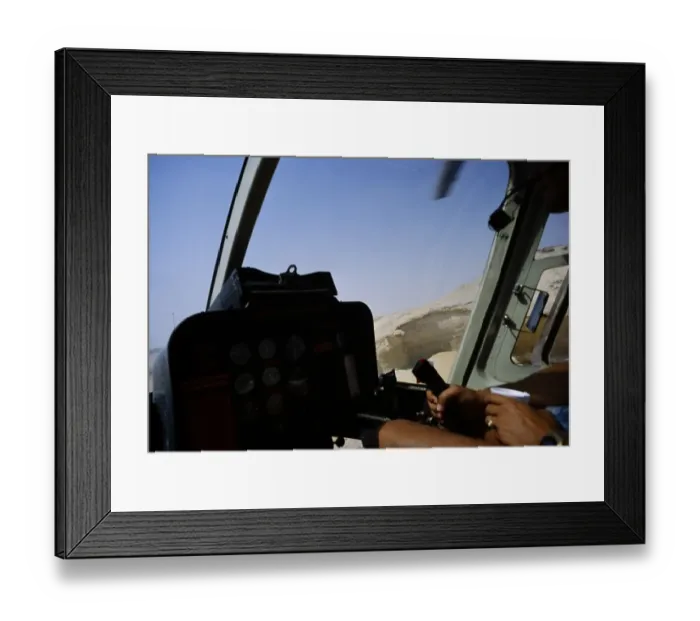 Framed Print : Oil industry Saudi Arabia, helicopter Bell 206 JetRanger 1979 Pilot in cockpit flying over desert Framed Print : Oil industry Saudi Arabia, helicopter Bell 206 JetRanger 1979 Pilot in cockpit flying over desert