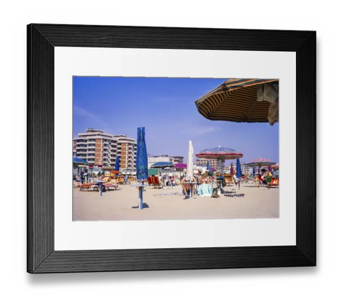 Framed Print : People sunbathing on the sandy beach of Rimini, Emilia Romagna region, Italy 1969