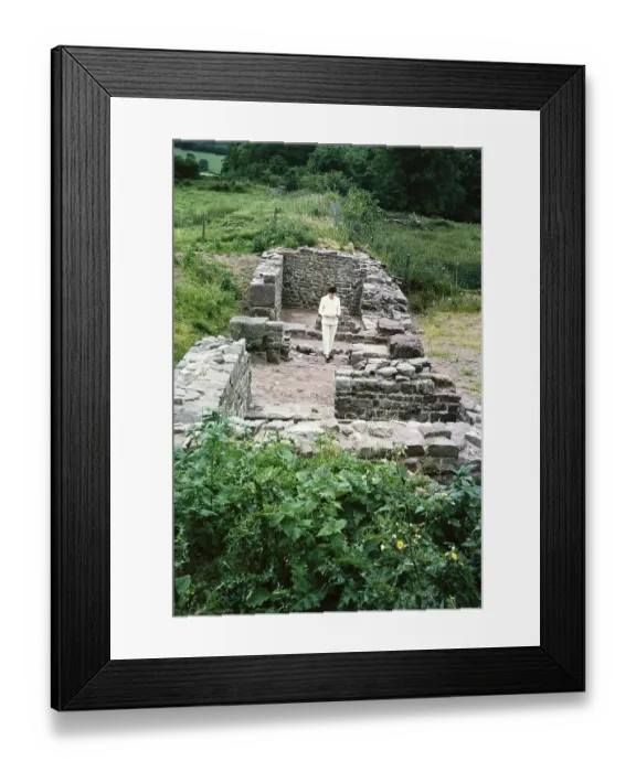 Framed Print : Woman standing in Y Gaer south gatehouse of the Roman fort, AD75-AD140, Brecon, Brecknockshire, Powys, Wales, UK 1967