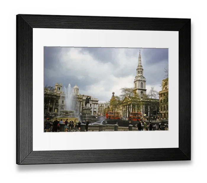 Framed Print : Red double-decker buses drive past the church of St Martin in the Fields, Trafalgar Square, London, England, UK 1962