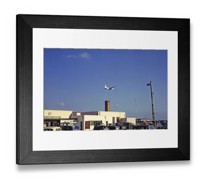 Framed Print : Silver City Airways ferry, Bristol Superfreighter aeroplane flying over the terminal buildings, Ferryfield Airport, Lydd, Kent England, UK 1959 Framed Print : Silver City Airways ferry, Bristol Superfreighter aeroplane flying over the terminal buildings, Ferryfield Airport, Lydd, Kent England, UK 1959