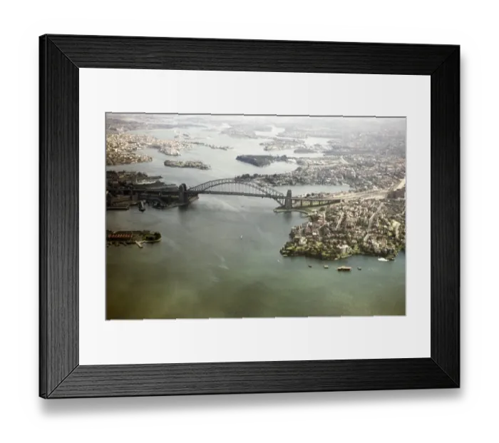 Framed Print : Oblique aerial view of the Sydney Harbour Bridge, Sydney, New South Wales, Australia 1956 before the construction of the Opera House on the peninsula to the left Framed Print : Oblique aerial view of the Sydney Harbour Bridge, Sydney, New South Wales, Australia 1956 before the construction of the Opera House on the peninsula to the left