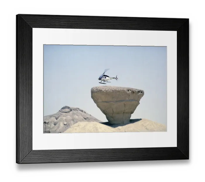 Framed Print : Bell 206 JetRanger helicopter landing on a rocky outcrop Arabian Desert, Saudi Arabia Oil industry 1979