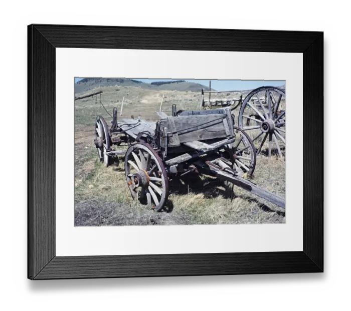 Framed Print : Nevada City historic ghost town, Montana, USA old broken down wooden wagons