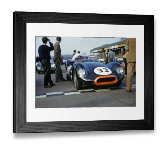Framed Print : Blurred photo of British sports racing driver Bill de Selincourt (1921 2014) at the wheel of the Lister Jaguar Knobbly Auto 33, BARC Goodwood event, March 1961 on the start line