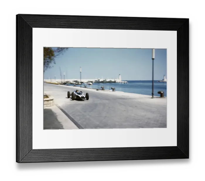 Framed Print : Forumla One Motorsport Monaco Grand Prix 1961, Bruce McLaren in the Cooper Climax approaches the tobacco kiosk
