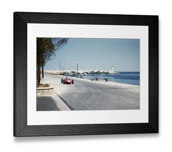 Framed Print : Formula One race at the 1961 Monaco Grand Prix, Richie Ginther in a shark-nosed Ferrari 156 F1 approaching a tobacco kiosk