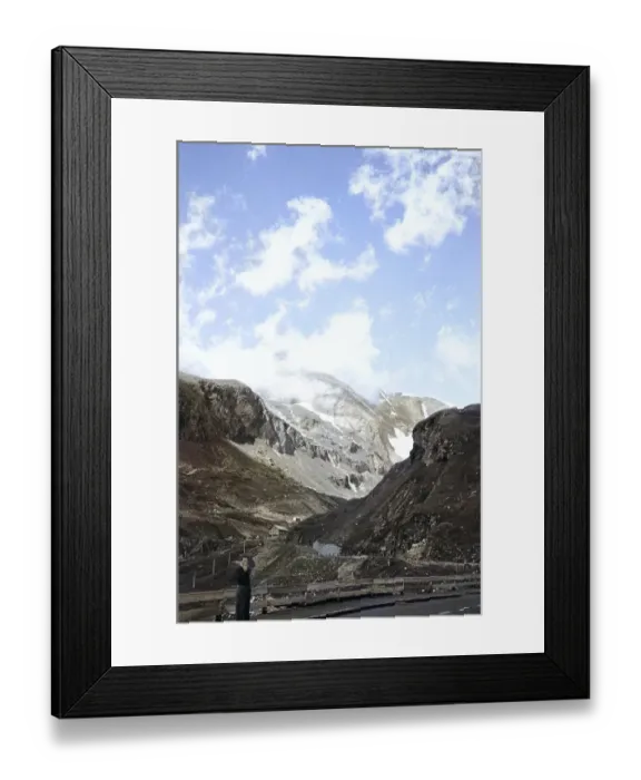 Framed Print : Man standing on Alpine mountain overland adventure trip 1956 on mountain road, Austria, Europe