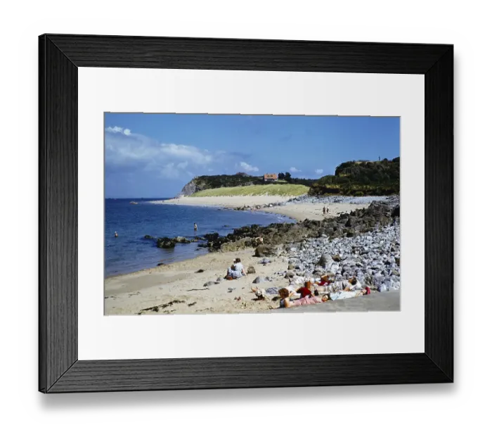Framed Print : People sunbathing on the beach at Priory Bay, Caldey Island, Pembrokeshire Wales, United Kingdom in the late 1950s