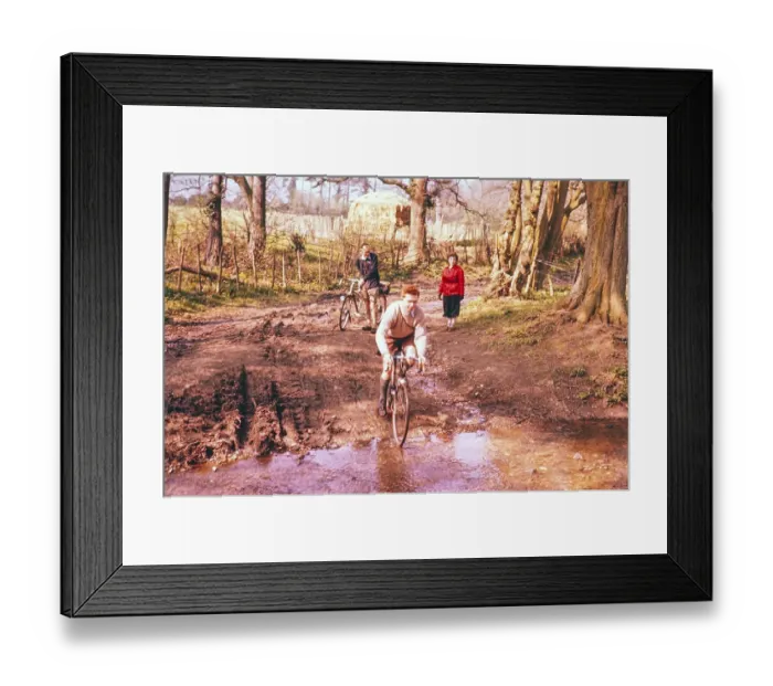Framed Print : Cyclist on a country lane crossing a stream, South England, Great Britain 1957 Framed Print : Cyclist on a country lane crossing a stream, South England, Great Britain 1957