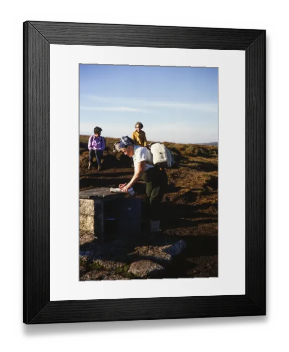Framed Print : Visitor signing the guestbook, letterbox at Cranmere Pool, Dartmoor National Park, Devon, England, UK 1975 Framed Print : Visitor signing the guestbook, letterbox at Cranmere Pool, Dartmoor National Park, Devon, England, UK 1975