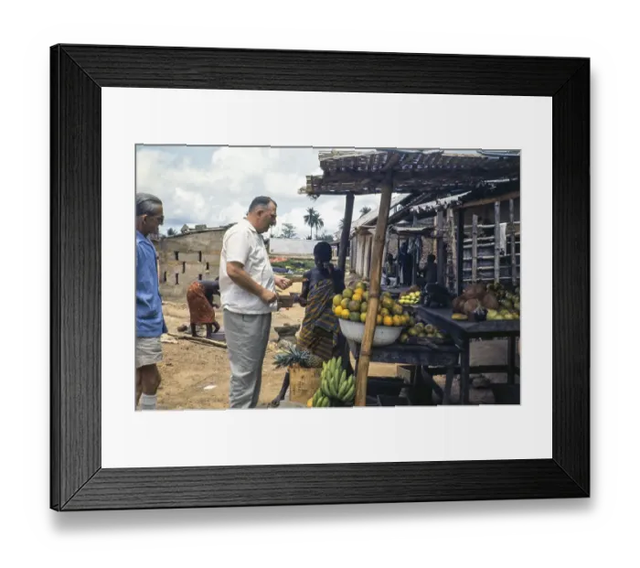 Framed Print : European emigrant buying fruit at a street market, Sierra Leone, West Africa 1963 1964, Africa