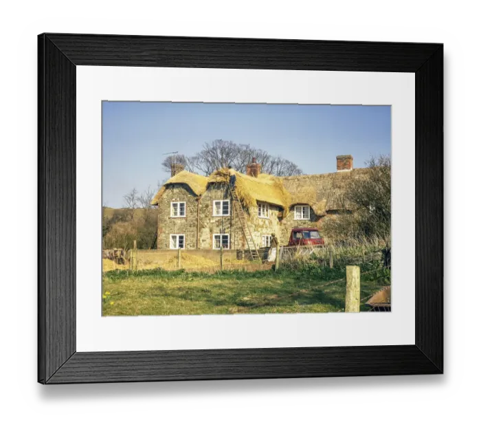 Framed Print : Thatcher at work on the roof of a timber-framed house, Isle of Wight, England, UK 1973
