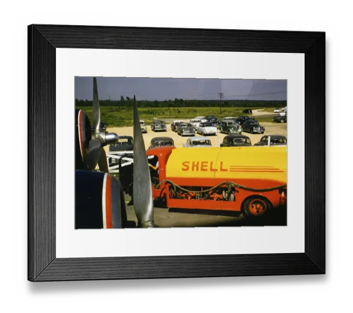 Framed Print : Shell oil tanker, seen through an aeroplane window with cars parked behind it, USA around 1953 Framed Print : Shell oil tanker, seen through an aeroplane window with cars parked behind it, USA around 1953