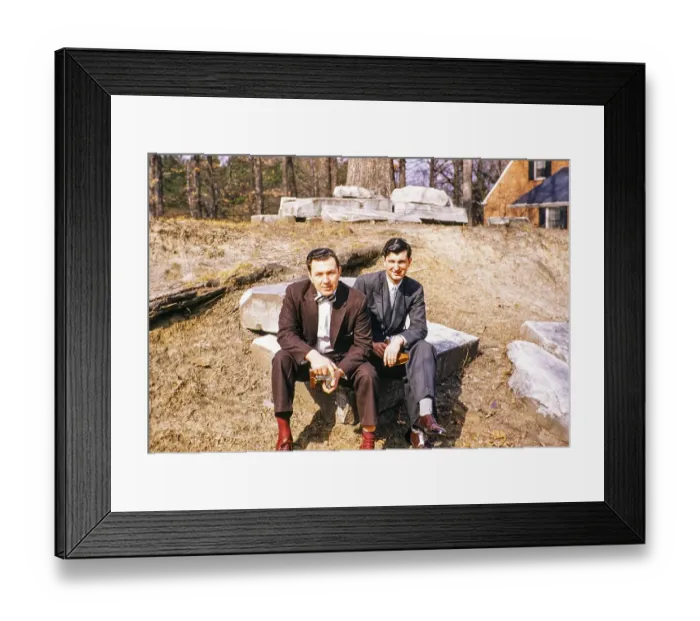 Framed Print : Two elegantly dressed men sitting outside and looking into the camera, USA around 1953