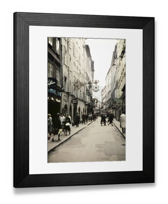 Framed Print : People shopping city centre alleyway of Getreidegasse, prominent guild sign for Wirtshausschild Sternbraeu, Salzburg, Austria, Europe 1960, Europe