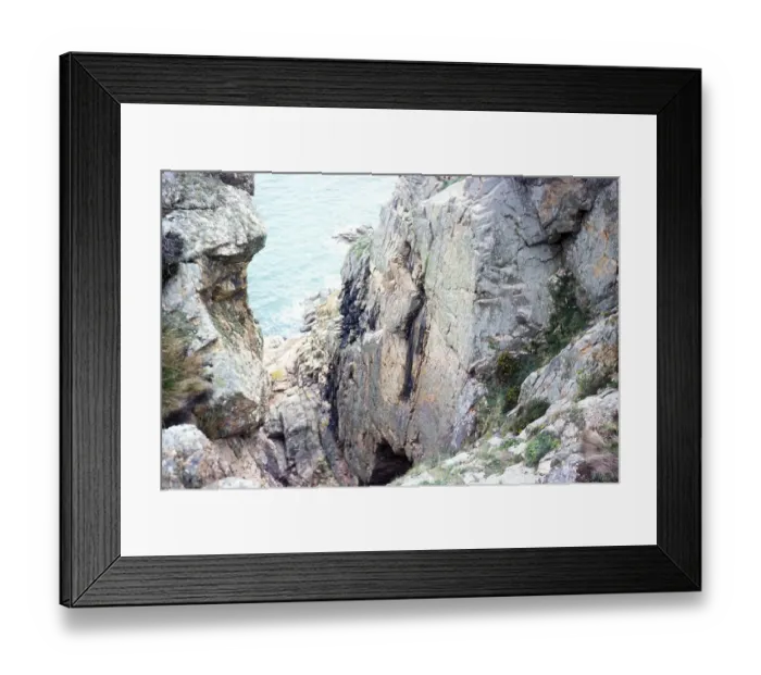Framed Print : View from the cliff to the cave entrance of La Cotte de St Brelade, Palaeolithic archaeological site, Jersey, Channel Islands 1976, Europe Framed Print : View from the cliff to the cave entrance of La Cotte de St Brelade, Palaeolithic archaeological site, Jersey, Channel Islands 1976, Europe