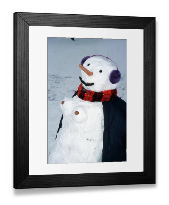 Framed Print : Snowwoman, snowman with ear protectors