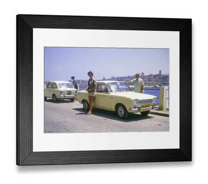 Framed Print : Male tourists standing by Avis hire car, Ford Escort Mk 1, Valletta, Malta, Europe 1971, Europe
