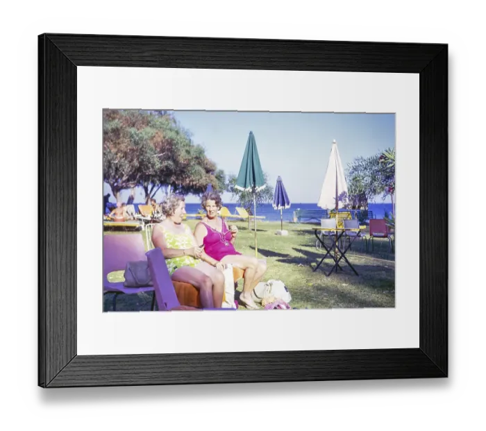 Framed Print : Two women sitting sunbathing in hotel garden, Cyprus, Europe 1973, Europe
